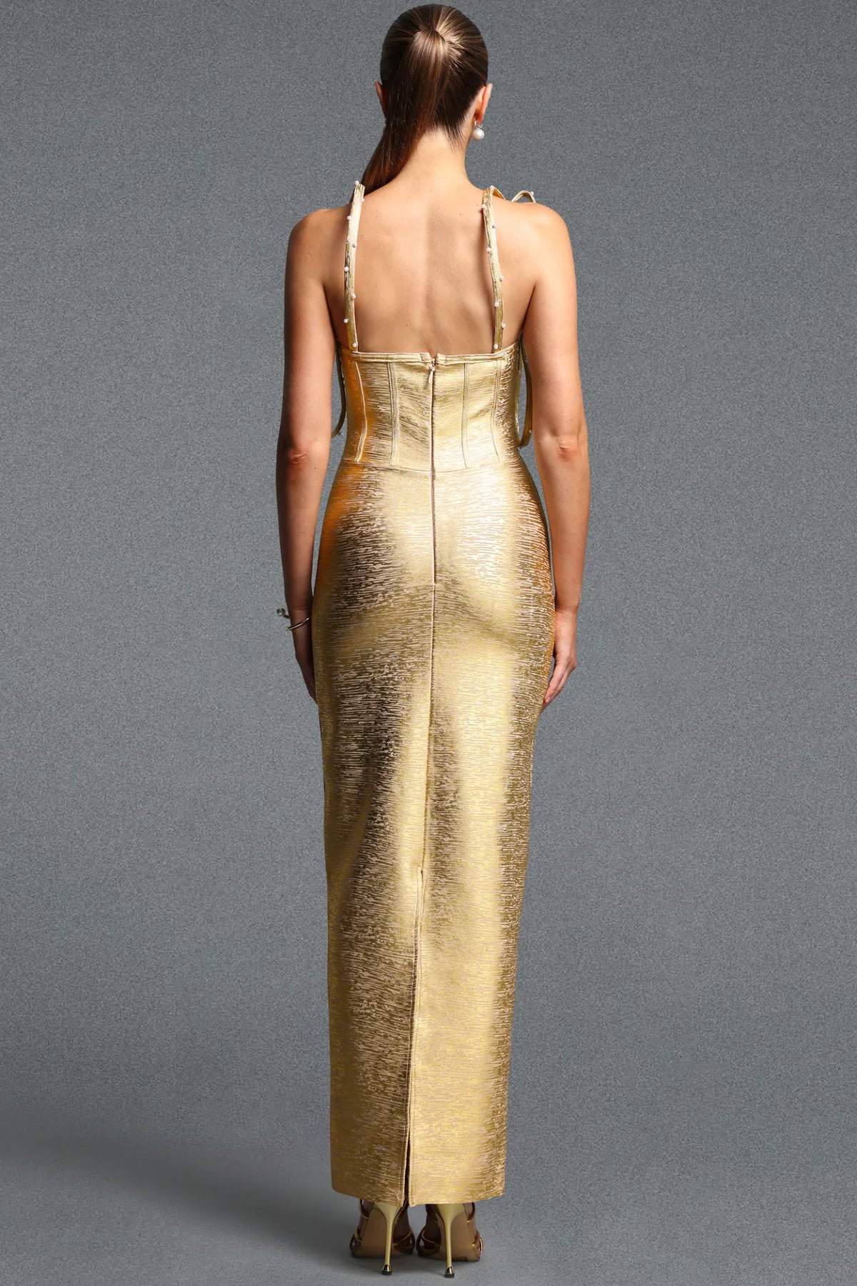 Avant-Garde Gold Column Gown with Floating Arches