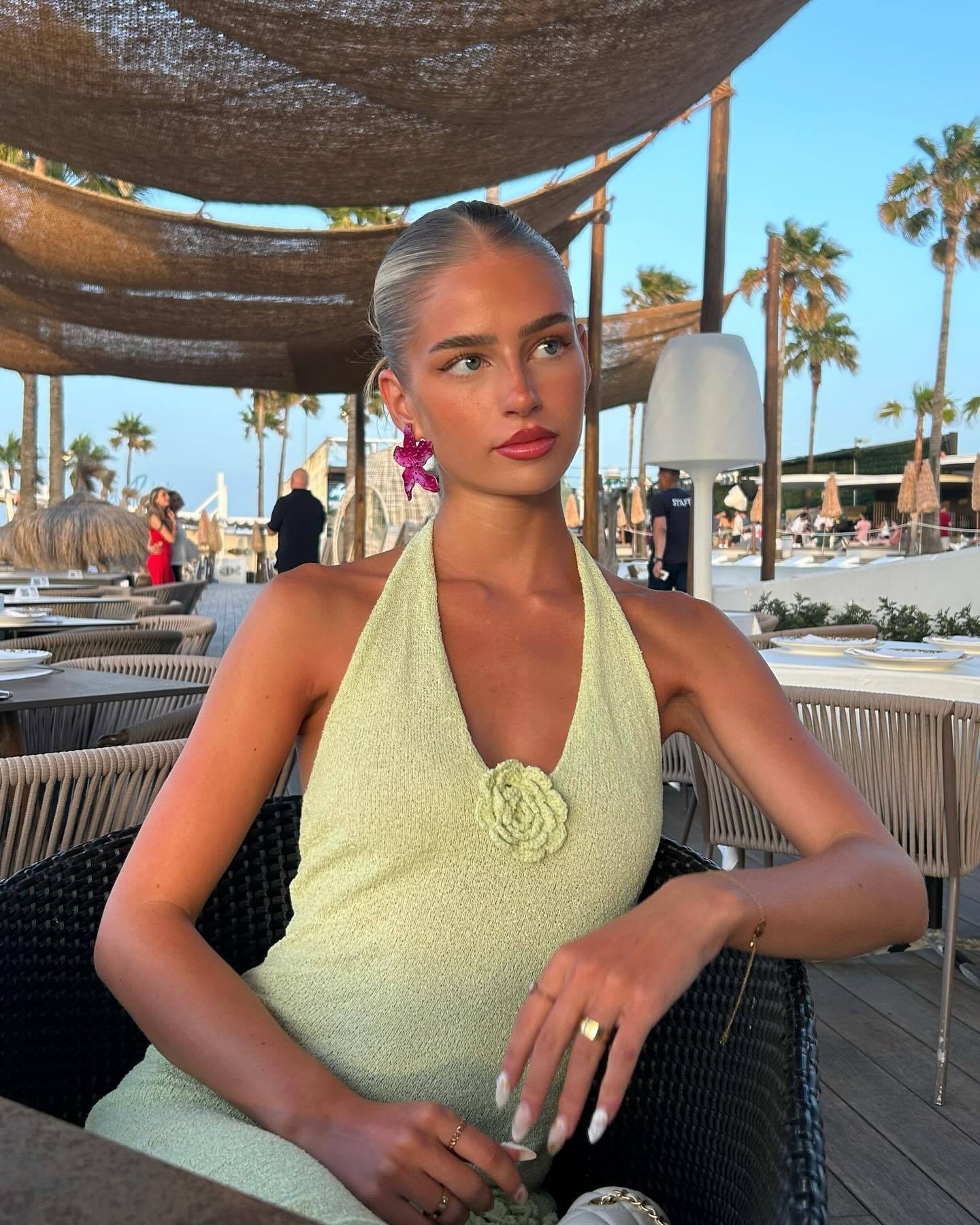 Light green halter maxi dress with a thigh-high slit