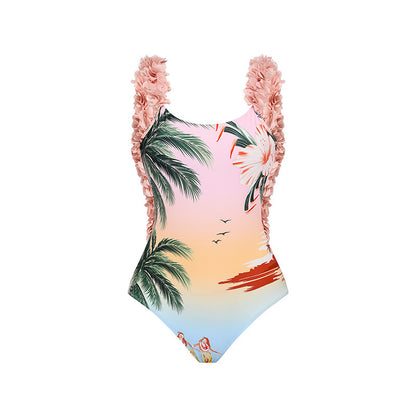 A two-piece ruffled bikini with a palm tree print is paired with a matching sarong