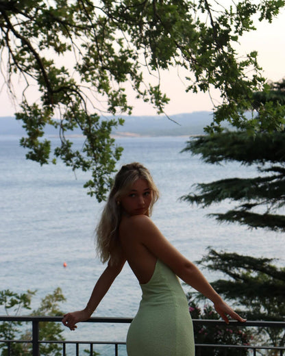 Light green halter maxi dress with a thigh-high slit