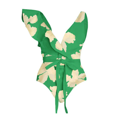 Green and cream floral two-piece swimsuit with a tie-front top and a matching high-waisted wrap skirt.