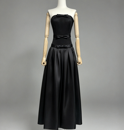 Elegant Black Strapless Gown with Voluminous Satin Skirt